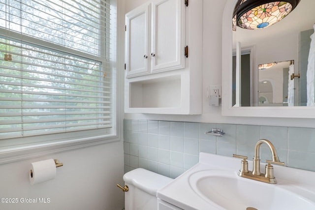 462-470 2nd Ave, Troy, NY 12182 - bathroom featuring decorative backsplash, vanity, and tile walls