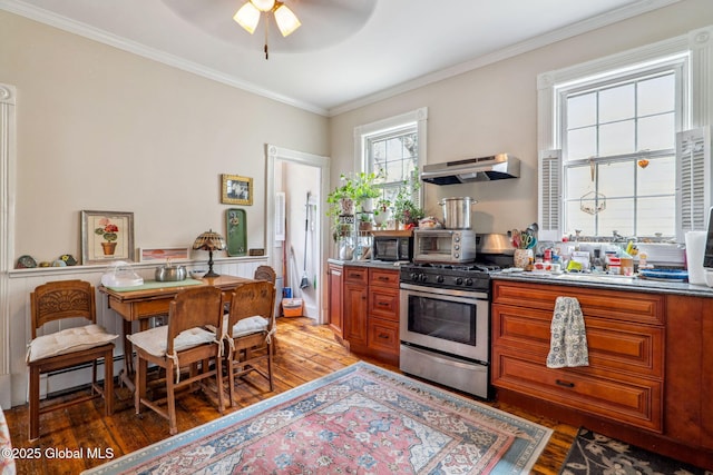 462-470 2nd Ave, Troy, NY 12182 - kitchen with gas stove, light wood-style floors, wall chimney exhaust hood, brown cabinets, and ornamental molding