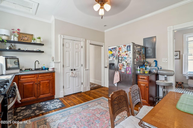 462-470 2nd Ave, Troy, NY 12182 - kitchen with stainless steel appliances, wood finished floors, a ceiling fan, crown molding, and brown cabinets