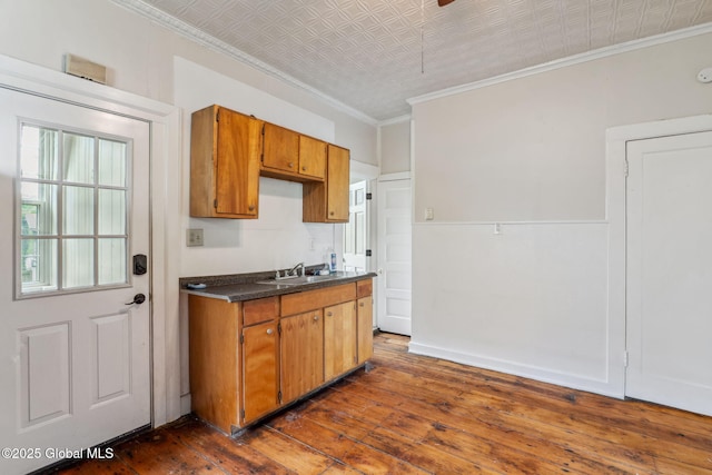 462-470 2nd Ave, Troy, NY 12182 - kitchen featuring an ornate ceiling, dark countertops, dark wood-style floors, brown cabinetry, and ornamental molding