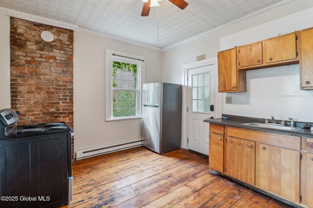 462-470 2nd Ave, Troy, NY 12182 - kitchen with freestanding refrigerator, baseboard heating, black / electric stove, an ornate ceiling, and hardwood / wood-style floors