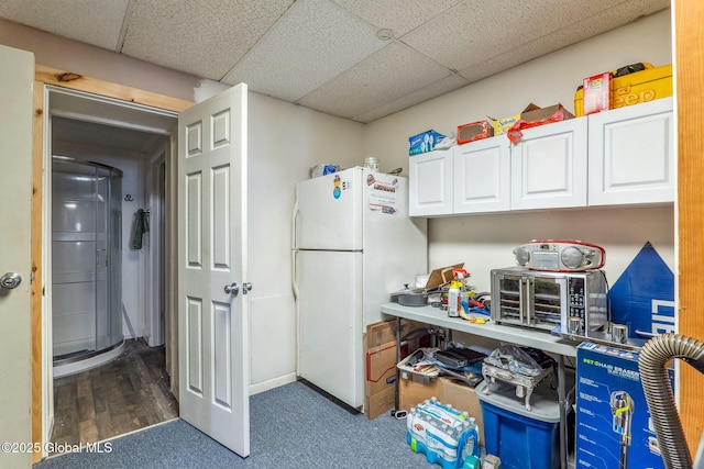 462-470 2nd Ave, Troy, NY 12182 - kitchen with freestanding refrigerator, a paneled ceiling, and white cabinetry