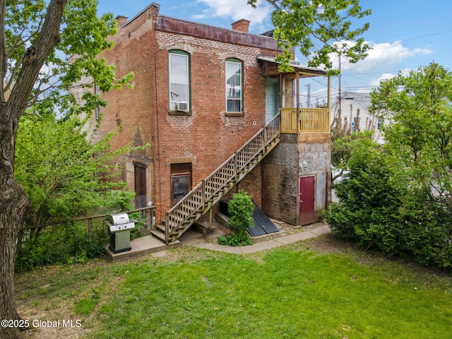 462-470 2nd Ave, Troy, NY 12182 - view of front of house featuring a front yard, brick siding, stairway, and a chimney