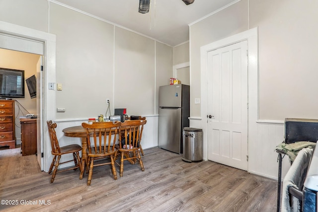 462-470 2nd Ave, Troy, NY 12182 - dining space with crown molding, wood finished floors, a wainscoted wall, a decorative wall, and ceiling fan
