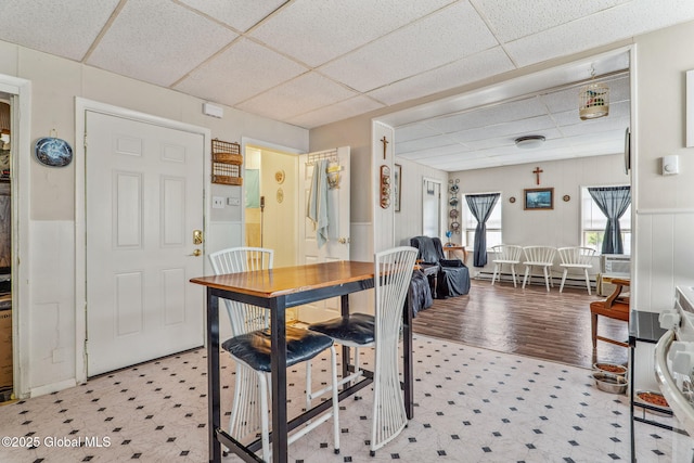 462-470 2nd Ave, Troy, NY 12182 - dining space featuring a paneled ceiling, light flooring, a wainscoted wall, and a baseboard radiator