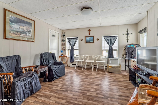 462-470 2nd Ave, Troy, NY 12182 - living area featuring wood finished floors, a drop ceiling, and baseboard heating
