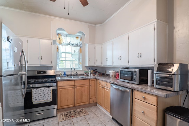 462-470 2nd Ave, Troy, NY 12182 - kitchen featuring appliances with stainless steel finishes, ornamental molding, ceiling fan, light tile patterned flooring, and white cabinets