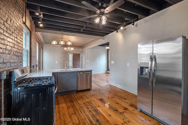 462-470 2nd Ave, Troy, NY 12182 - kitchen with stainless steel appliances, track lighting, light wood finished floors, a chandelier, and ceiling fan
