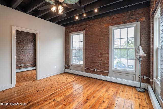 462-470 2nd Ave, Troy, NY 12182 - unfurnished room with a baseboard heating unit, brick wall, beam ceiling, plenty of natural light, and hardwood / wood-style floors