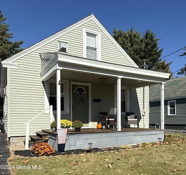 31 Wilson Ave, South Glens Falls, NY 12803 - view of front of property featuring a porch and a front yard