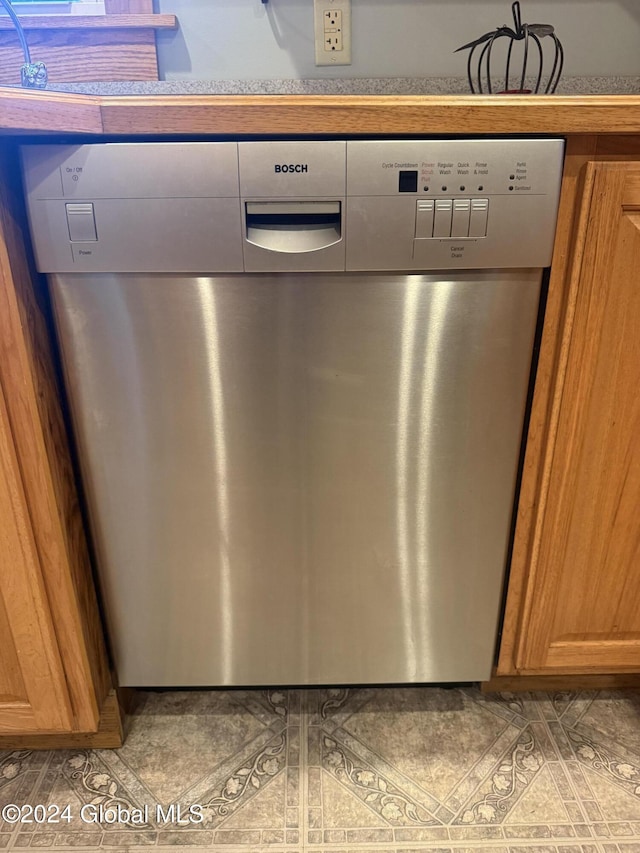 31 Wilson Ave, South Glens Falls, NY 12803 - kitchen view of dishwasher and brown cabinets