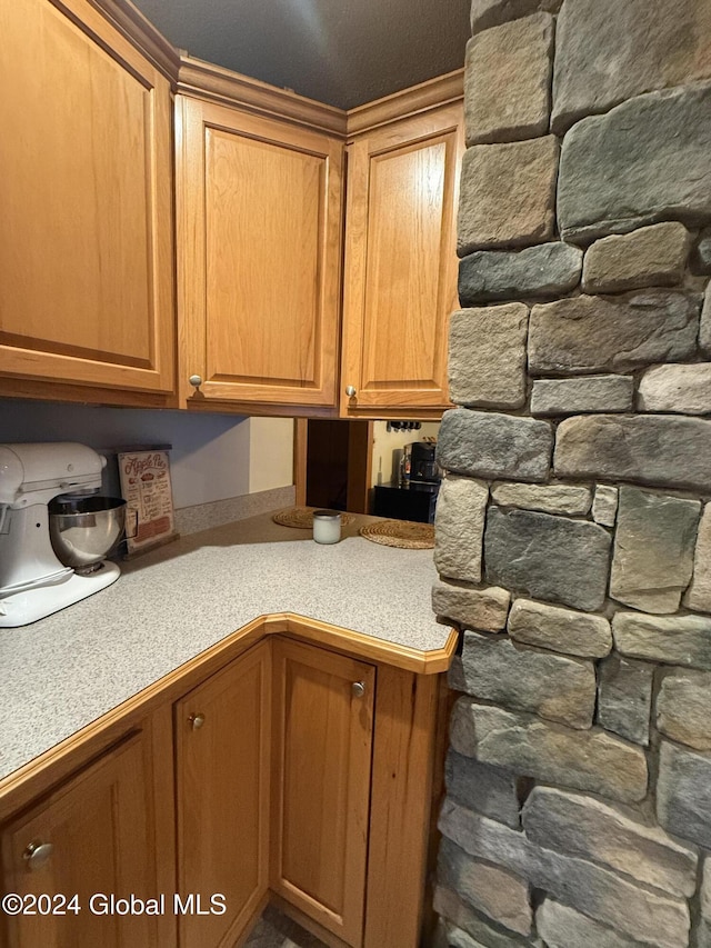 31 Wilson Ave, South Glens Falls, NY 12803 - kitchen featuring light countertops and brown cabinetry
