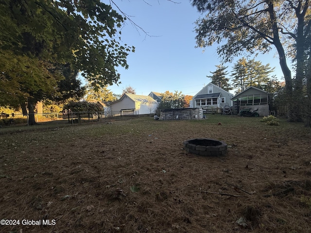 31 Wilson Ave, South Glens Falls, NY 12803 - fenced backyard featuring a fire pit