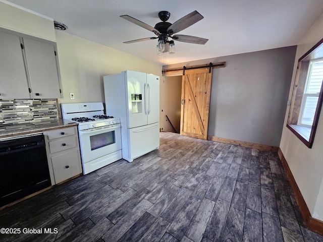 1335 Midline Rd, Amsterdam, NY 12010 - kitchen featuring white appliances, a barn door, dark wood finished floors, a ceiling fan, and backsplash