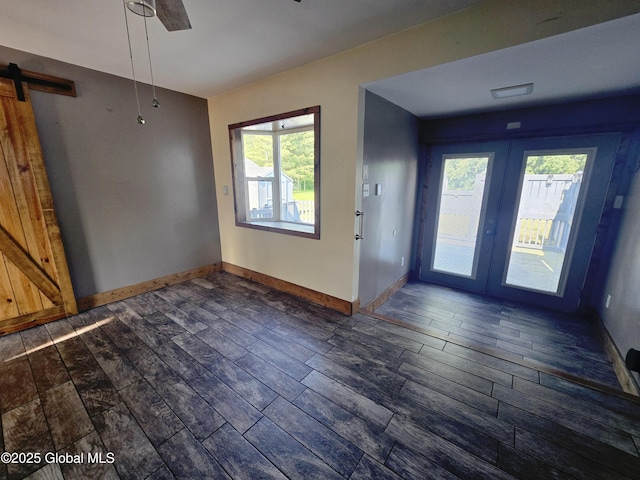 1335 Midline Rd, Amsterdam, NY 12010 - unfurnished dining area with a barn door, wood tiled floors, and french doors
