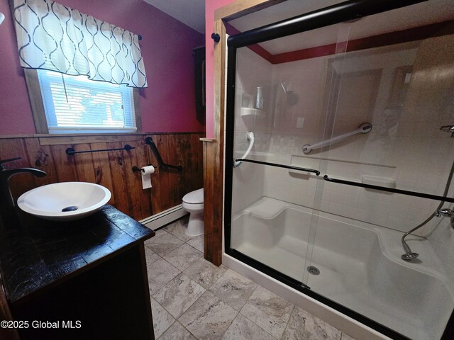 1335 Midline Rd, Amsterdam, NY 12010 - full bath with wainscoting, baseboard heating, a stall shower, vanity, and wood walls