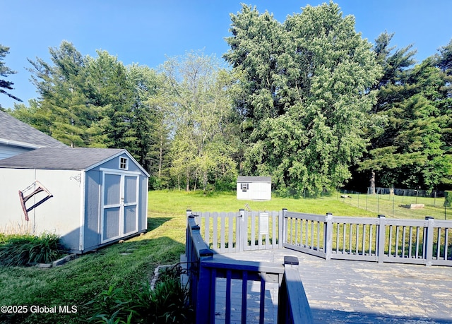 1335 Midline Rd, Amsterdam, NY 12010 - view of grassy yard with a storage unit and a deck