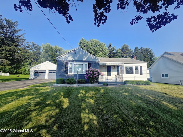 1335 Midline Rd, Amsterdam, NY 12010 - view of front of home featuring an outdoor structure, a garage, a chimney, and a front lawn