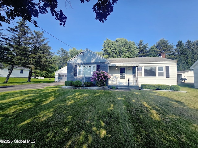 1335 Midline Rd, Amsterdam, NY 12010 - view of front facade featuring a front yard, a chimney, and a garage