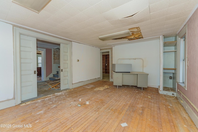 3885 Main St, Warrensburg, NY 12885 - unfurnished living room with wood-type flooring and stairs