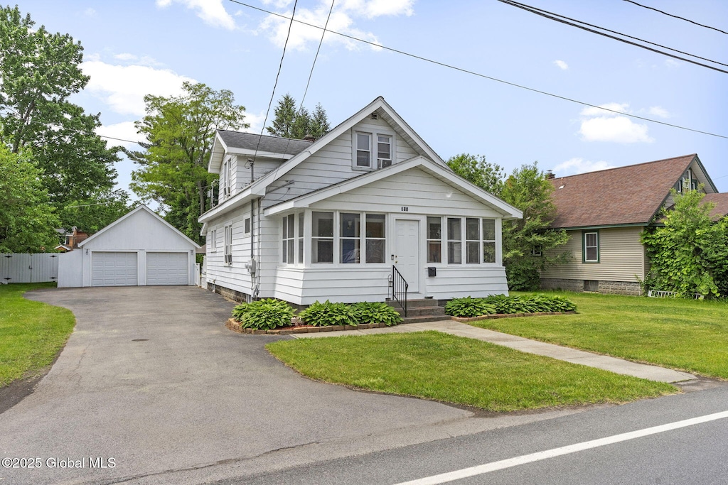 210 E Campbell Rd, Rotterdam, NY 12303 - view of front of property with a detached garage, an outdoor structure, entry steps, and a front yard