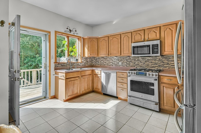 108 La Flamme Rd, Providence, NY 12850 - kitchen featuring appliances with stainless steel finishes, tasteful backsplash, light tile patterned flooring, and light countertops