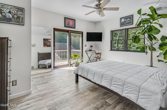 108 La Flamme Rd, Providence, NY 12850 - bedroom featuring access to exterior, multiple windows, and light wood-style floors