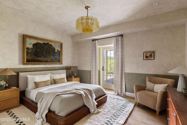 1174 Potter Mountain Rd, Gilboa, NY 12076 - bedroom with access to outside, wood finished floors, and a chandelier