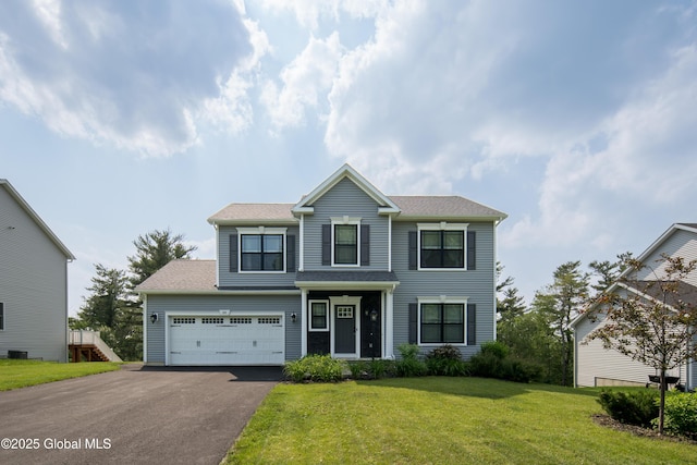 24 Utica Ave, Colonie, NY 12110 - traditional-style home featuring asphalt driveway and a front lawn