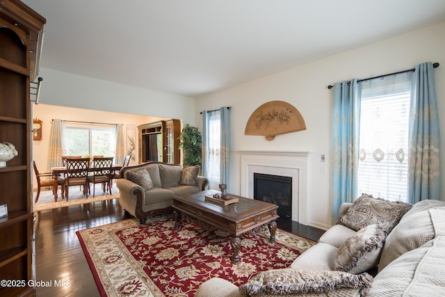 24 Utica Ave, Colonie, NY 12110 - living area with a fireplace with flush hearth and hardwood / wood-style floors