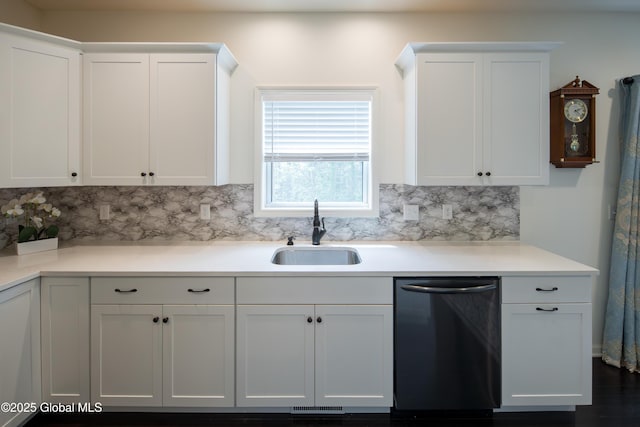 24 Utica Ave, Colonie, NY 12110 - kitchen featuring dishwashing machine, tasteful backsplash, white cabinets, and light countertops
