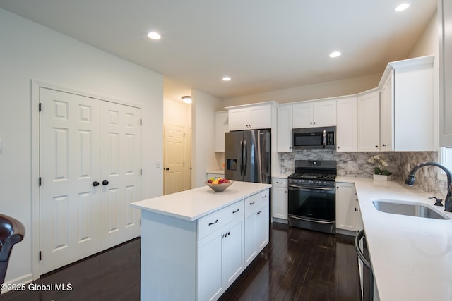 24 Utica Ave, Colonie, NY 12110 - kitchen featuring stainless steel appliances, backsplash, white cabinetry, and recessed lighting