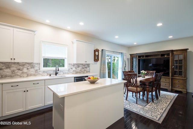 24 Utica Ave, Colonie, NY 12110 - kitchen with white cabinetry, decorative backsplash, recessed lighting, a kitchen island, and light countertops