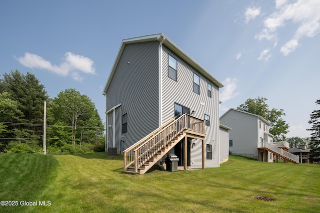 24 Utica Ave, Colonie, NY 12110 - back of house featuring stairway, a lawn, and a deck
