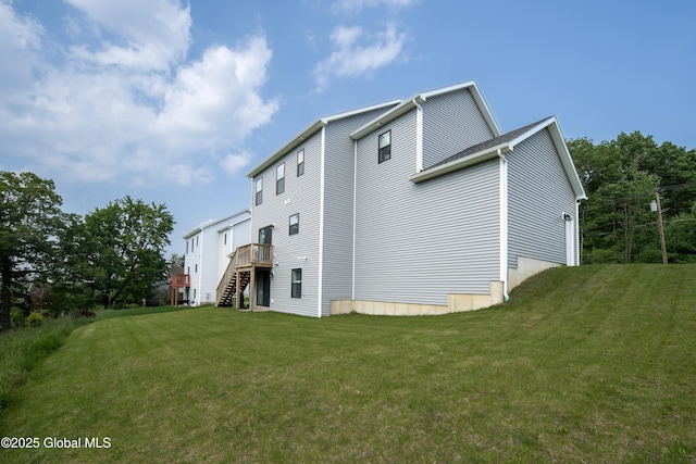 24 Utica Ave, Colonie, NY 12110 - back of house with stairs, a yard, and a wooden deck