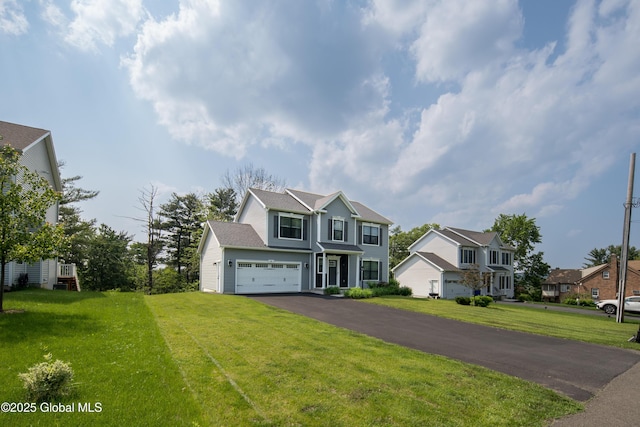 24 Utica Ave, Colonie, NY 12110 - traditional home featuring a garage, driveway, a front lawn, and a residential view