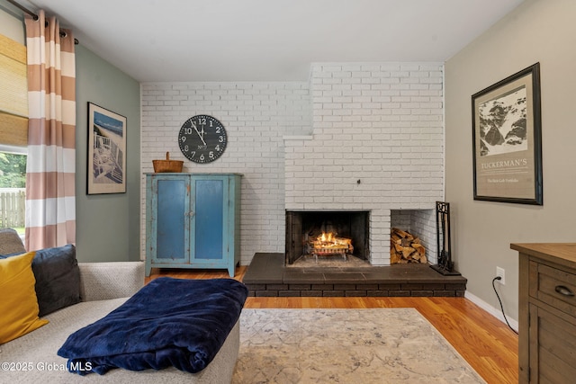 12 Glen Ter, Glenville, NY 12302 - living room featuring wood finished floors and a fireplace