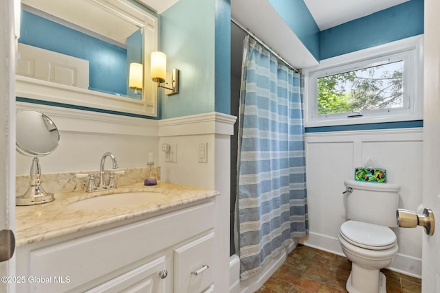 12 Glen Ter, Glenville, NY 12302 - full bathroom featuring vanity, stone finish flooring, and wainscoting
