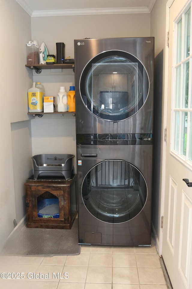 143 Maple Ave, Middleburgh, NY 12122 - washroom with stacked washer / drying machine, tile patterned flooring, and ornamental molding