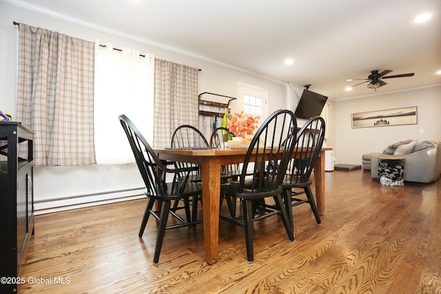 143 Maple Ave, Middleburgh, NY 12122 - dining room with a baseboard heating unit, crown molding, ceiling fan, wood finished floors, and recessed lighting