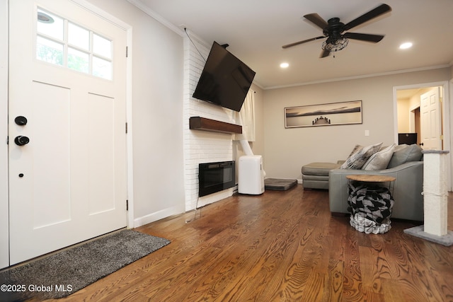 143 Maple Ave, Middleburgh, NY 12122 - living area with ornamental molding, a fireplace, a ceiling fan, wood finished floors, and recessed lighting