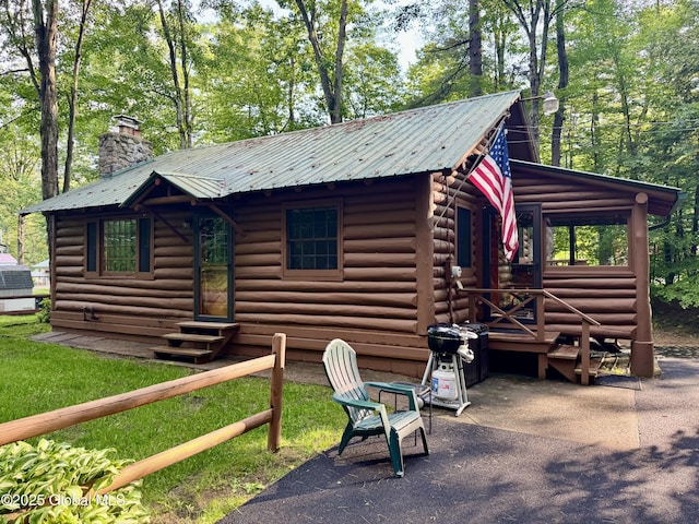 15 Corinth Pl, Hadley, NY 12835 - view of front of home with entry steps, a chimney, and a metal roof