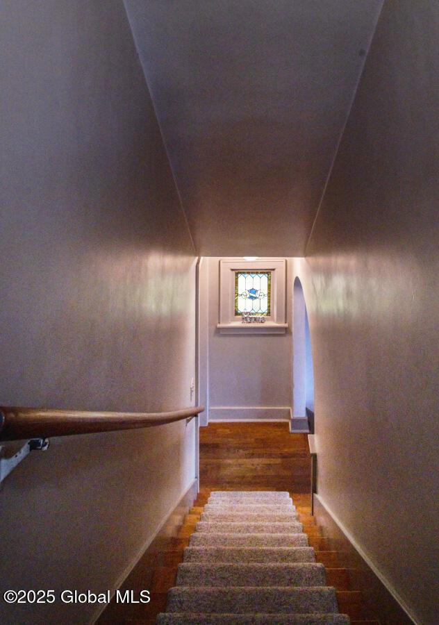 54 Wendell St, Ravena, NY 12143 - staircase with wood finished floors and arched walkways