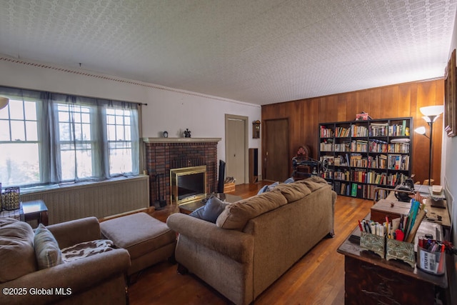 54 Wendell St, Ravena, NY 12143 - living area featuring wood walls, a fireplace, and wood finished floors