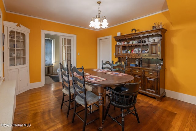 54 Wendell St, Ravena, NY 12143 - dining area featuring a chandelier, wood finished floors, ornamental molding, and radiator