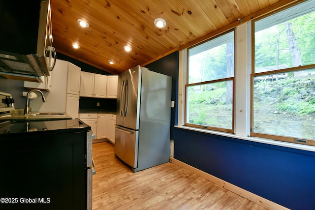 23 S Copeland Pond Way, Fort Ann, NY 12827 - kitchen featuring appliances with stainless steel finishes, plenty of natural light, white cabinets, vaulted ceiling, and recessed lighting