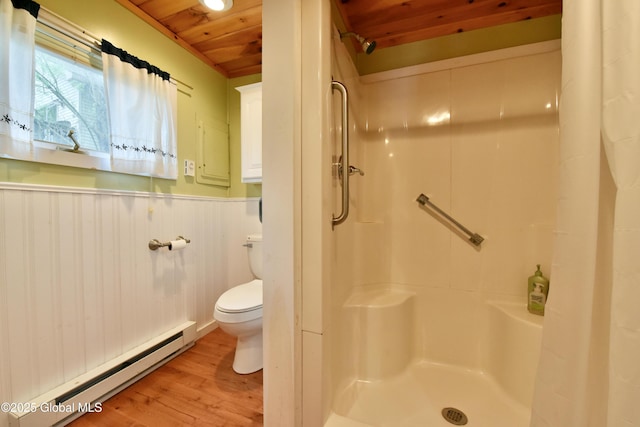 23 S Copeland Pond Way, Fort Ann, NY 12827 - full bath featuring a baseboard heating unit, wooden ceiling, a shower with curtain, wood finished floors, and a wainscoted wall