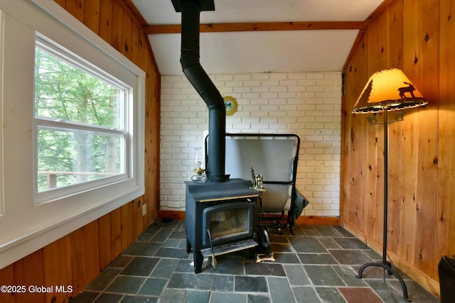 23 S Copeland Pond Way, Fort Ann, NY 12827 - detailed view of a wood stove, wood walls, and brick wall