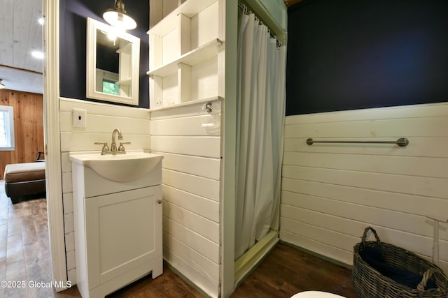 23 S Copeland Pond Way, Fort Ann, NY 12827 - full bath featuring vanity, wooden walls, a shower stall, and wood finished floors