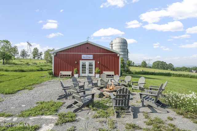 378 County Route 354, Rensselaerville, NY 12469 - view of patio featuring an outdoor fire pit, french doors, and a rural view